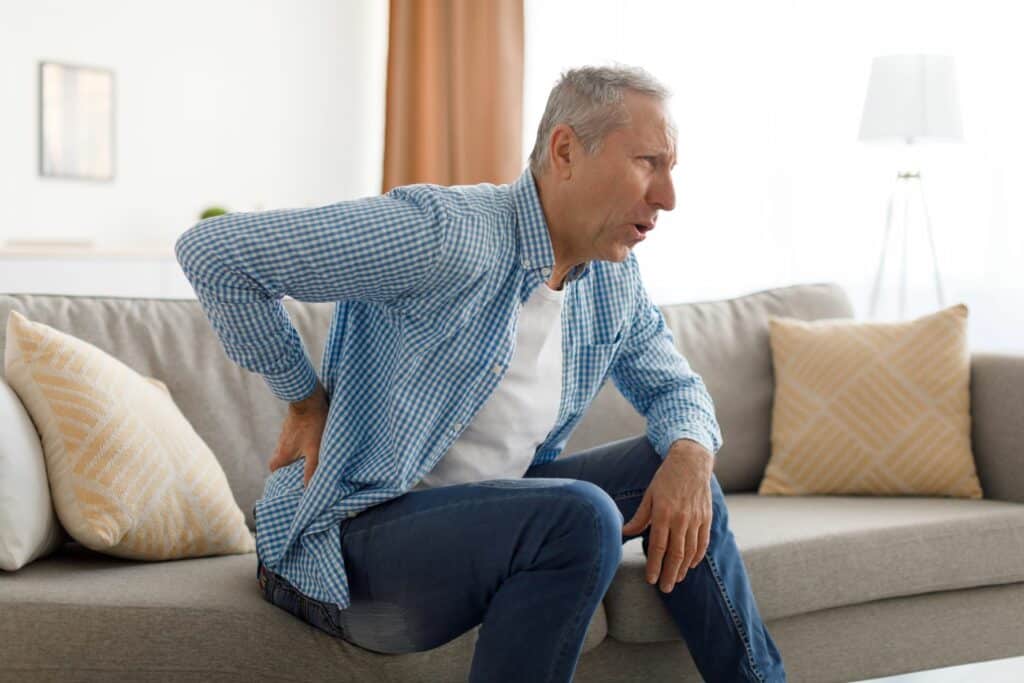 older male suffering from sciatica