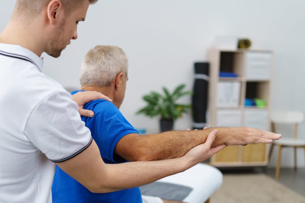 Physical therapist carrying out examination