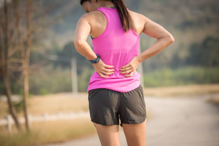 Female runner with back pain