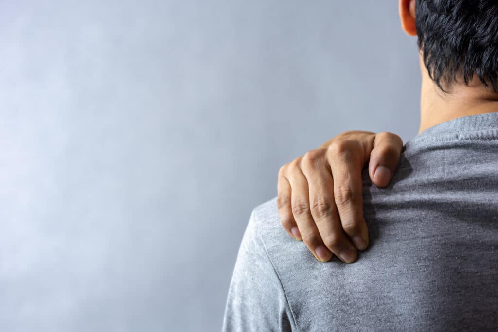 Man experiencing shoulder pain